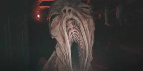 A mutant baby walking toward Ethan with its mouth open in Resident Evil Village