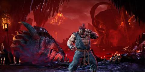 Akuma stands in a dark, fiery cavern in Street Fighter 6