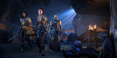 Adventurers in armor in a cave lit by a mysterious blue glow.