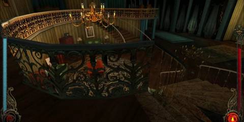 A spiraling staircase with a golden chandelier overlooking a lounge area