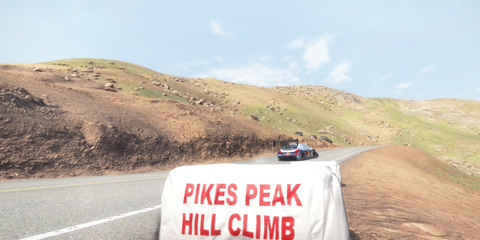 Wide Shot of the Pikes Peak International Hill Climb with Race Advertisement