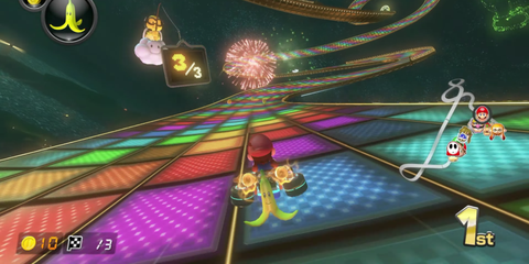 A Race of Rainbow Road in Mario Kart 8 with a Banana Weapon