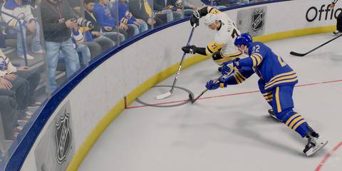 buffalo and pittsburgh battling for a puck