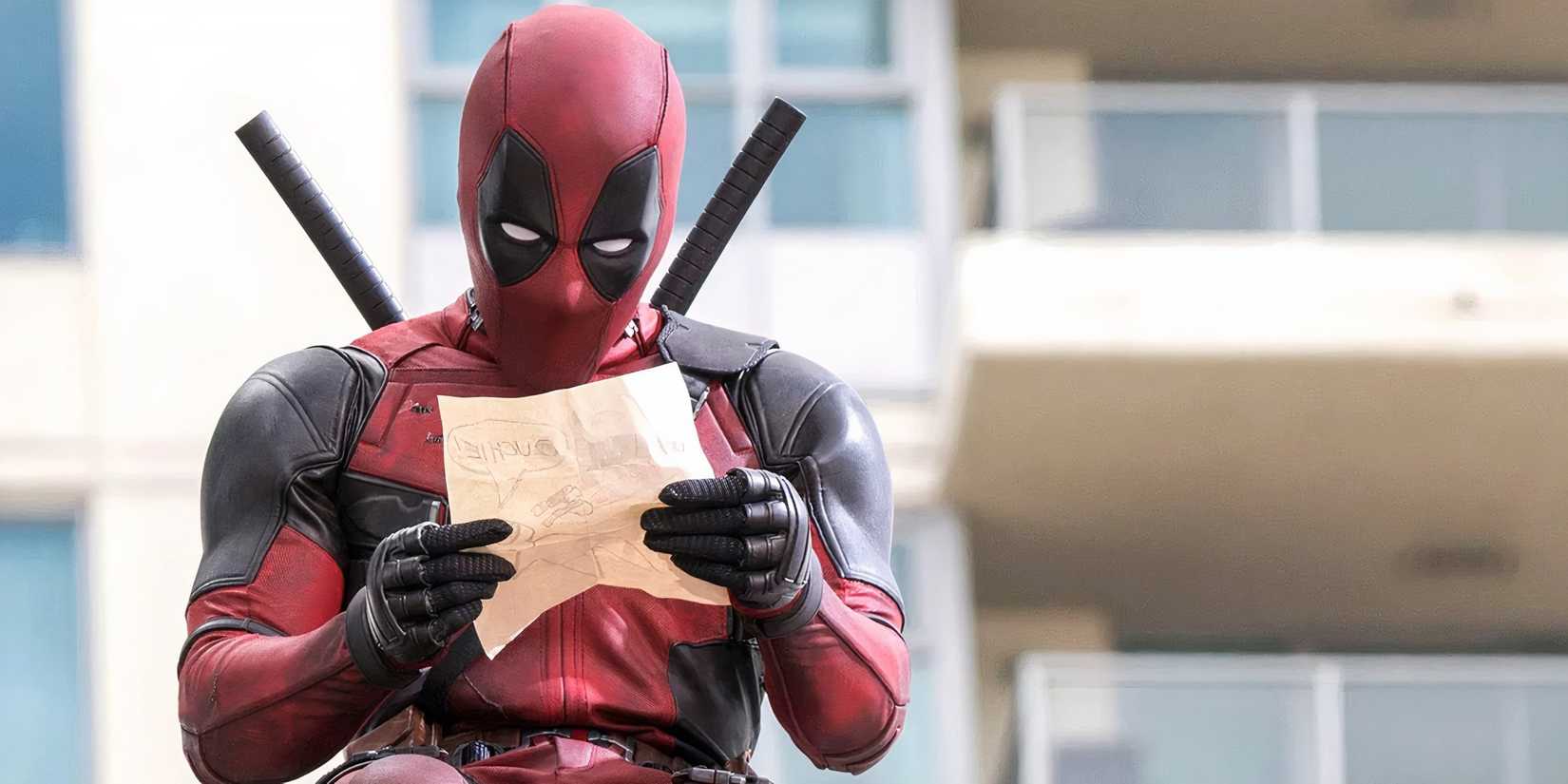 Deadpool holding a piece of paper