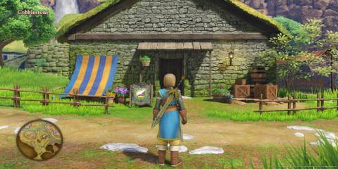 The Player Standing In Front Of The General Store In Cobblestone
