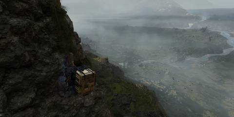 sam climbing a rock formation in death stranding