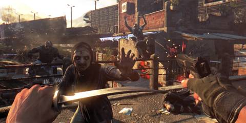 A man fending off a horde of zombies with a gun and a knife in Dying Light