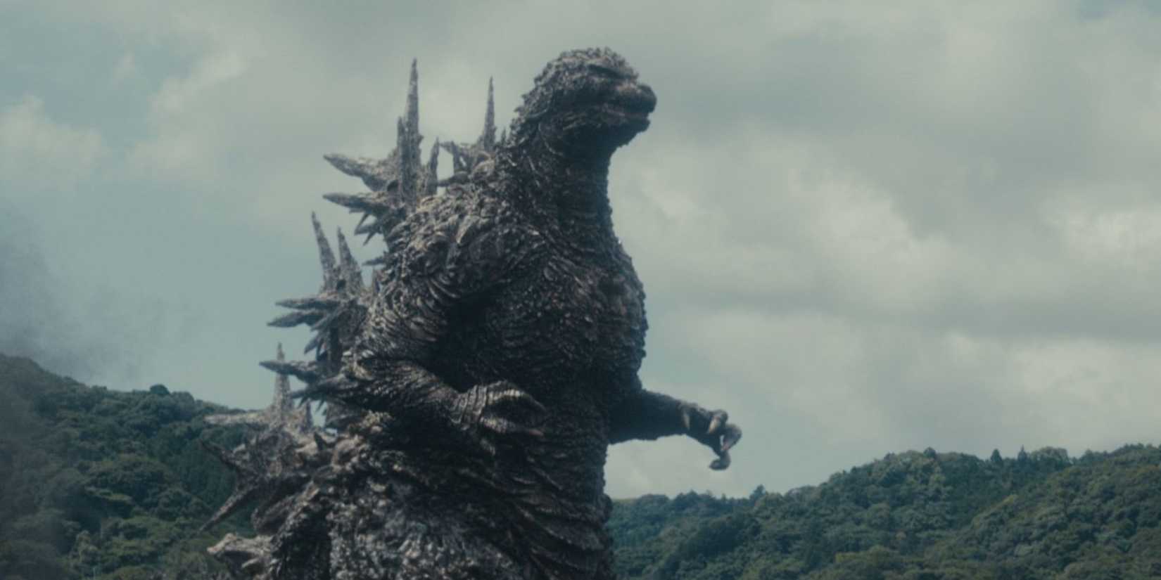 Godzilla walking through Japan and destroying everything in his path.