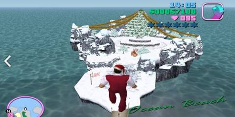 Tommy in front of a snowy island with a Christmas tree on it