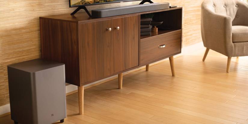 The JBL Bar 5.1 Surround soundbar and subwoofer in a living room.