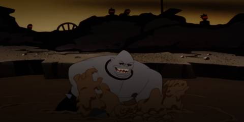 the mutant leader fighting batman in the mud