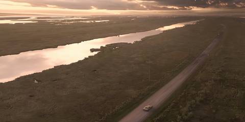 ethan driving towards the baker farm