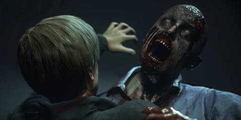 Leon Kennedy being attacked by a zombie in Resident Evil 2
