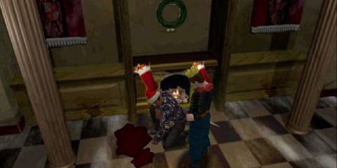 Barry and Chris inspecting a pool of blood in Christmas sweaters