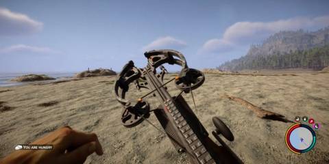 Sons of the Forest - A player wielding their Crossbow on the beach