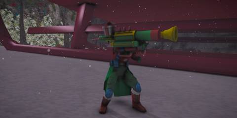 A character in an el costume holding a giant green and red bazooka 