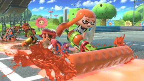 Female Inkling rolling orange ink over Mario and Samus on a Mario Kart track.