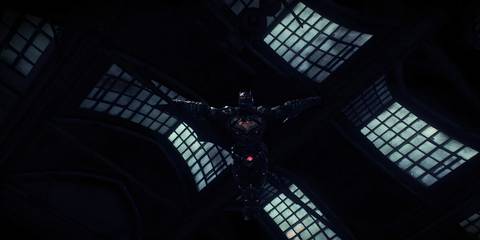 batman gliding through the air