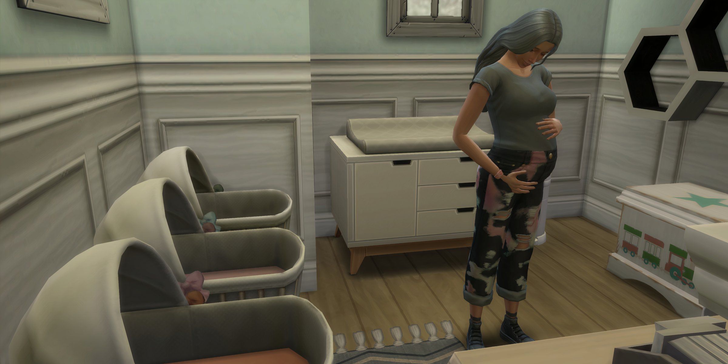 A pregnant Sim in front of three infant cots