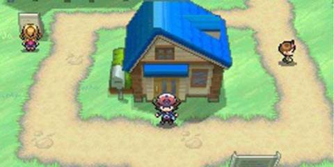 A player next to a house in Pokemon Black and White