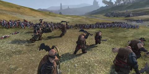 A Unit of Ogres Charging Into a Total War: Warhammer 3 Battle