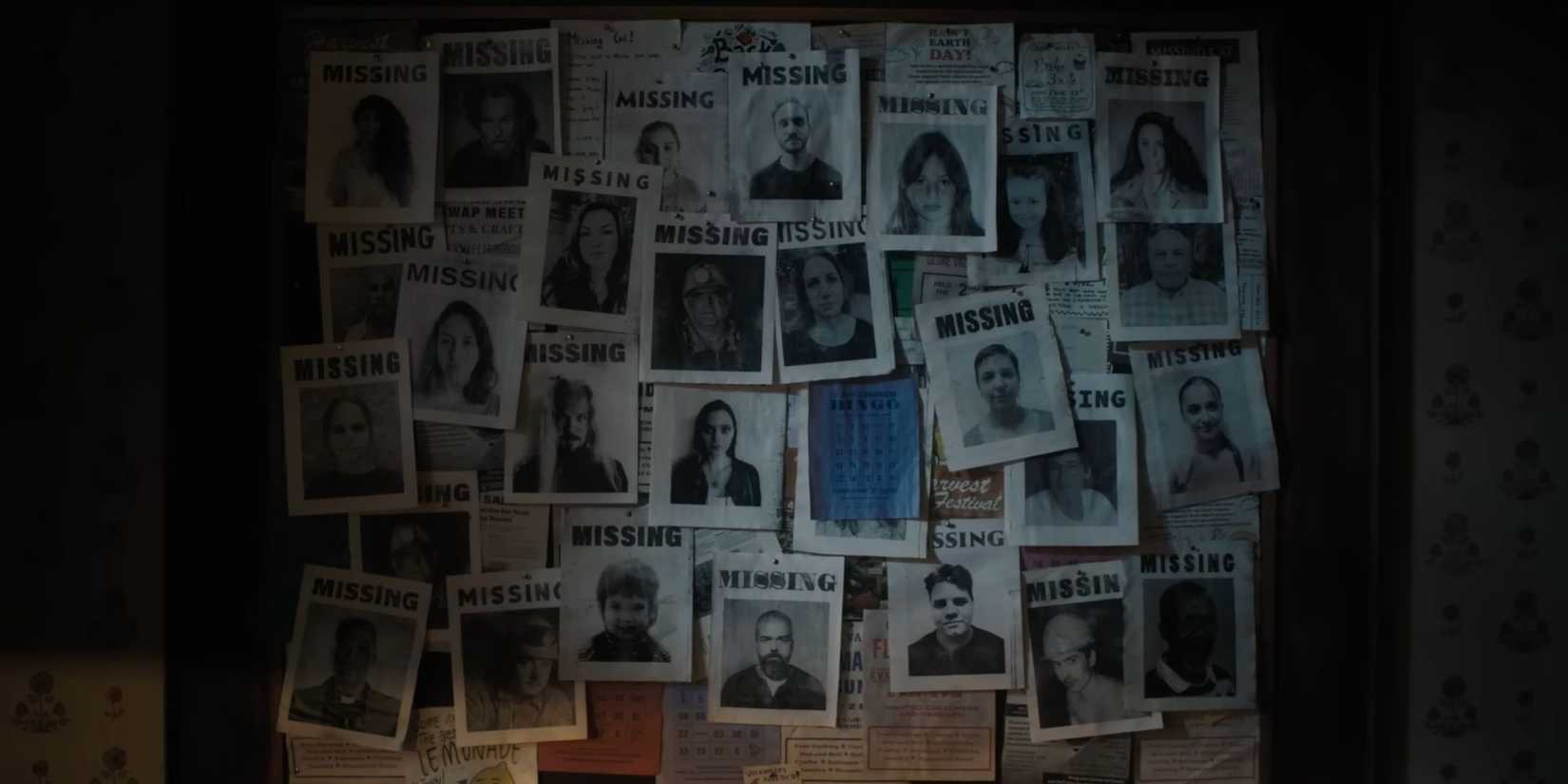 A board covered with missing person posters, reflecting the eerie atmosphere of Until Dawn's adaptation