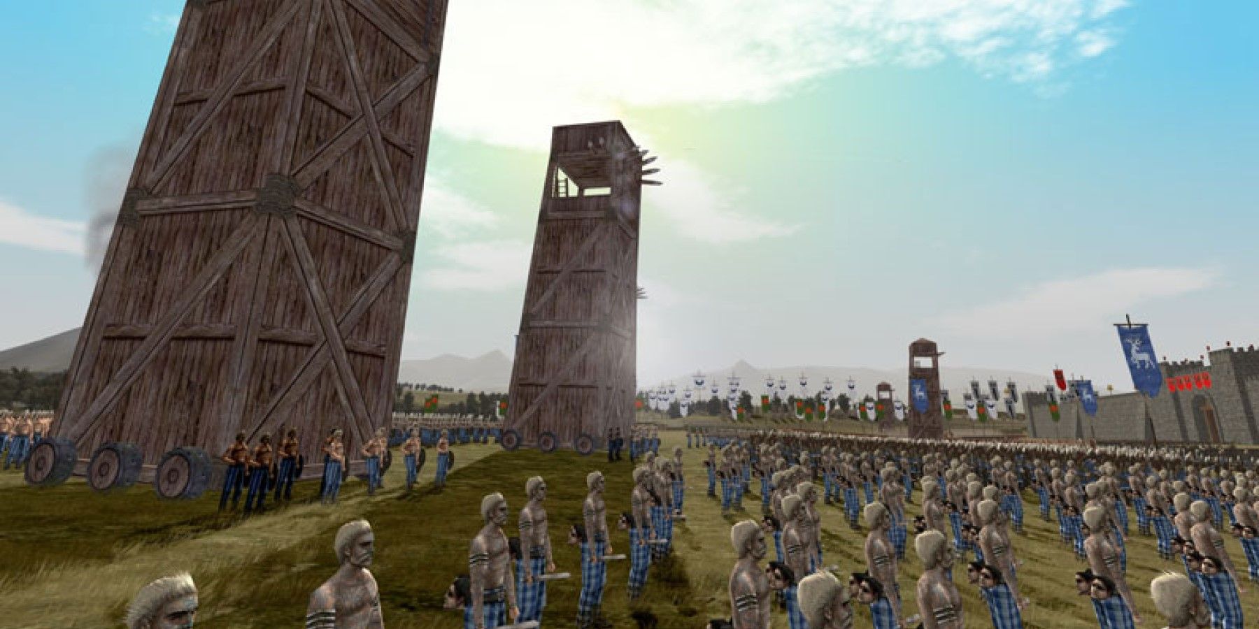 A Key Frame From Rome Total War Showing An Army Of Tartaned Characters Approaching A Settlement