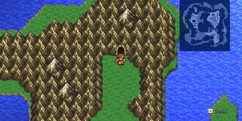 Entrance to a mountain cave in Final Fantasy 3 surrounded by medieval landscapes and sea