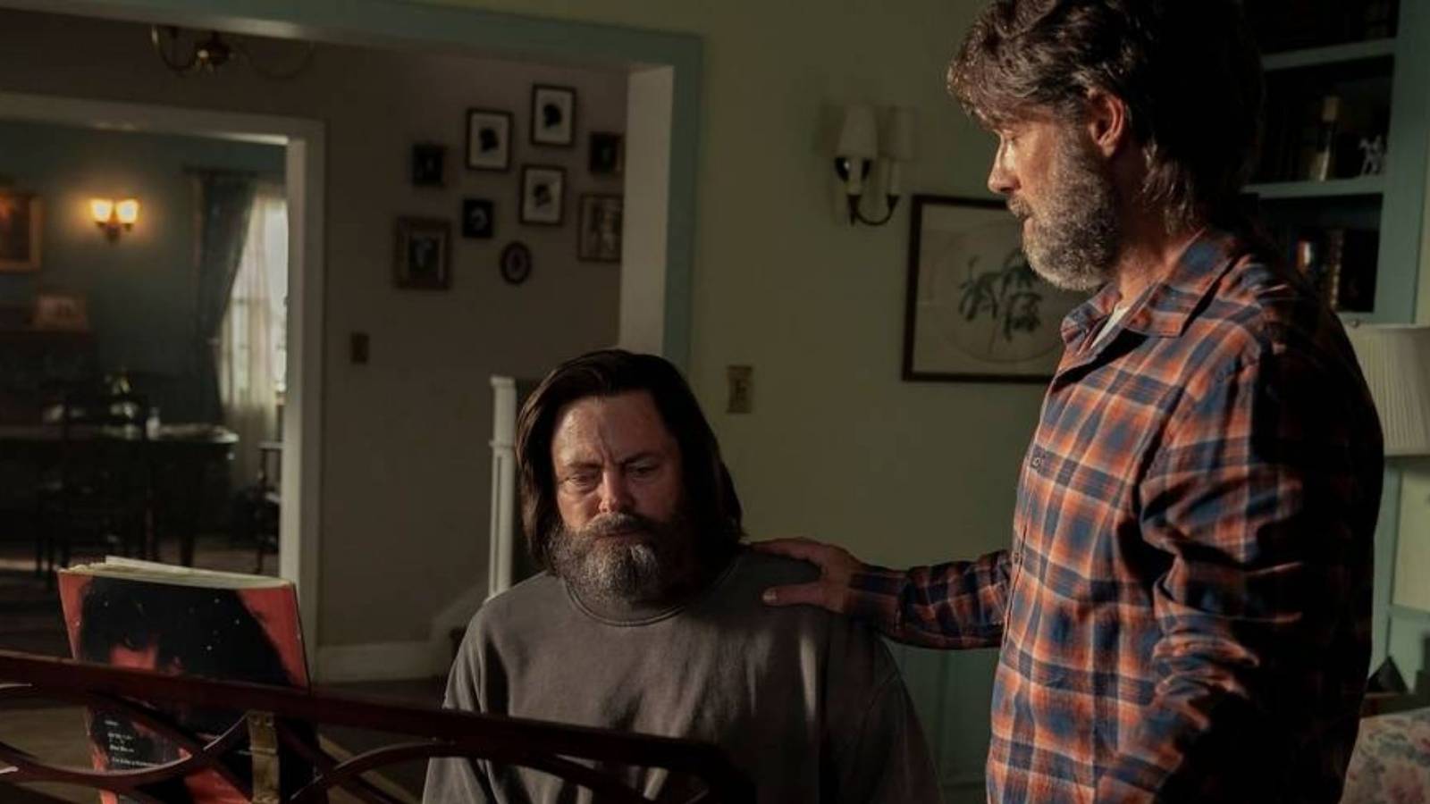 Frank places a comforting hand on Bill’s shoulder inside their home in episode 3 of The Last of Us