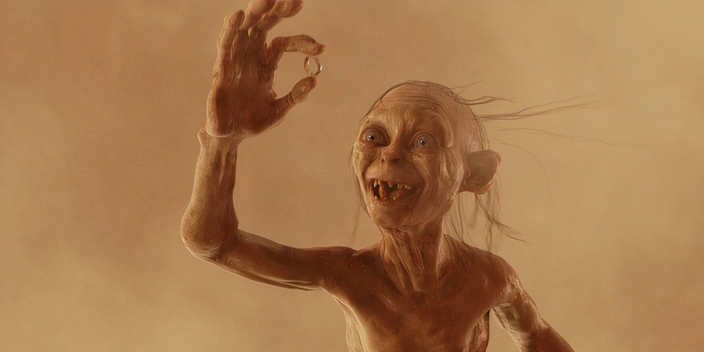 Gollum holds the ring 