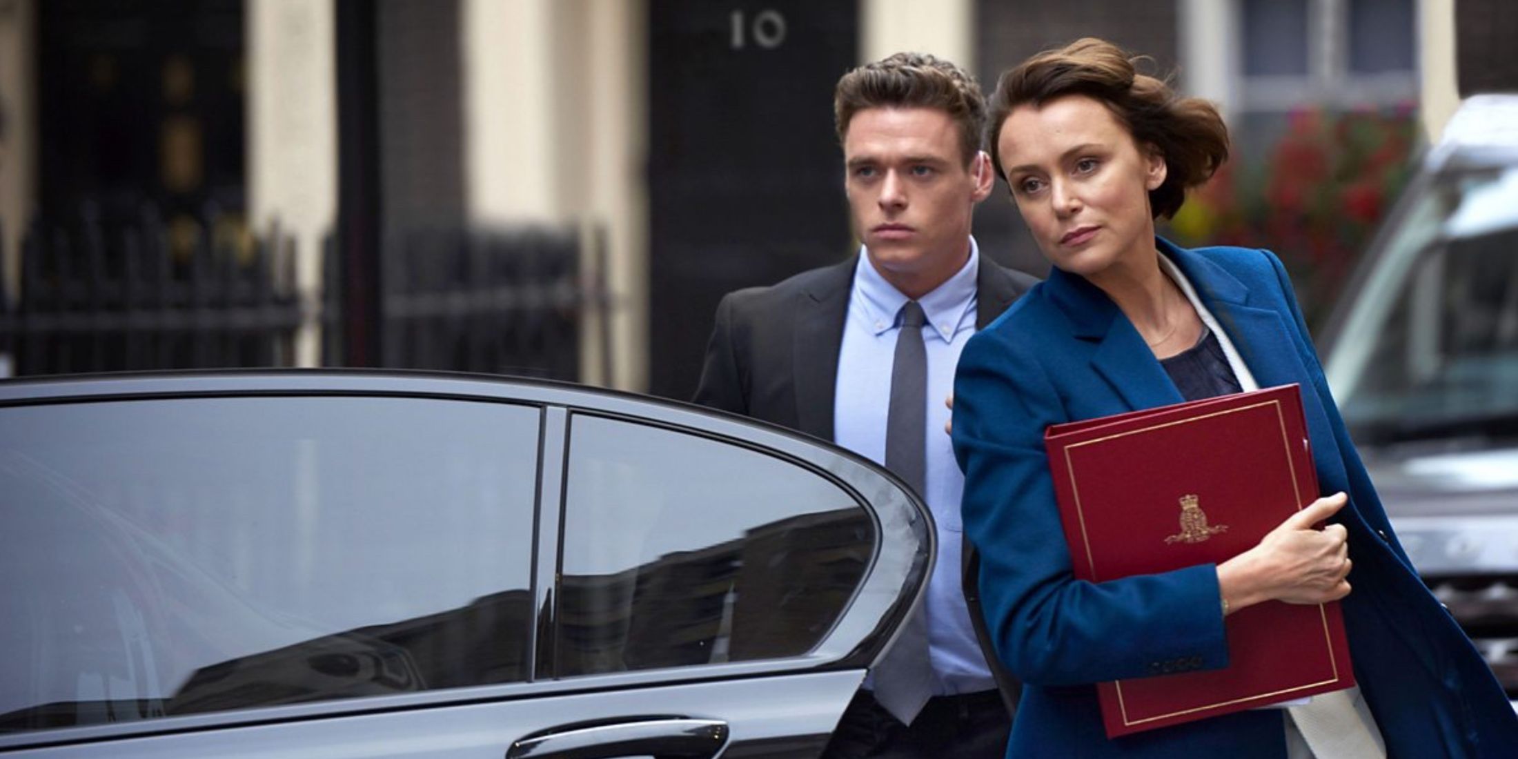 A politician (Keeley Hawes) being protected by a bodyguard (Richard Madden)