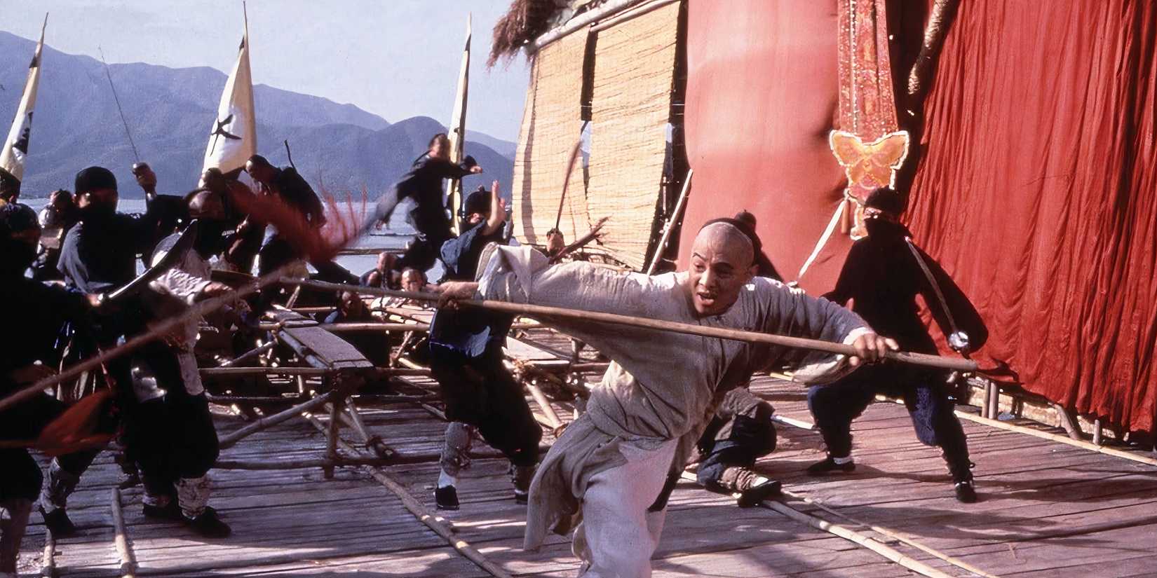 10 Best Jet Li Movies, Ranked Jet Li fights enemis with a staff