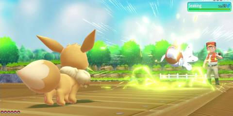 Partner Eevee fighting a Seaking.