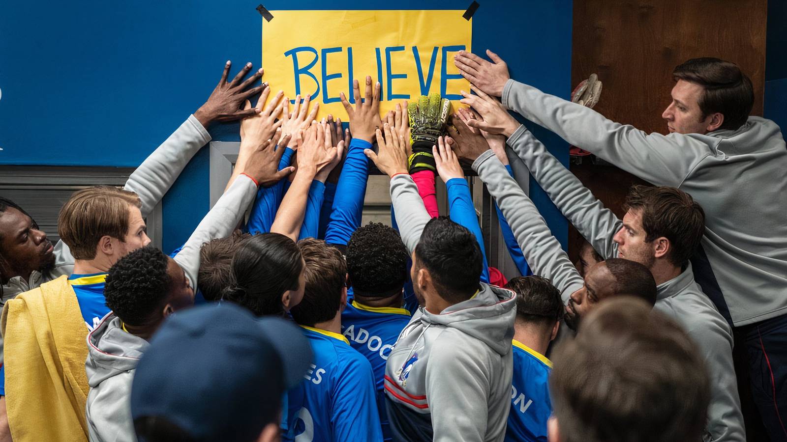 Players touch the Believe sign in Ted Lasso