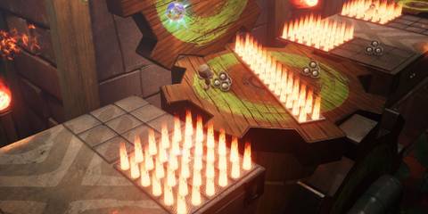 Sackboy avoiding some fire in Sackboy: A Big Adventure