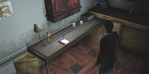 Harry Mason looking at. awhite and red save point