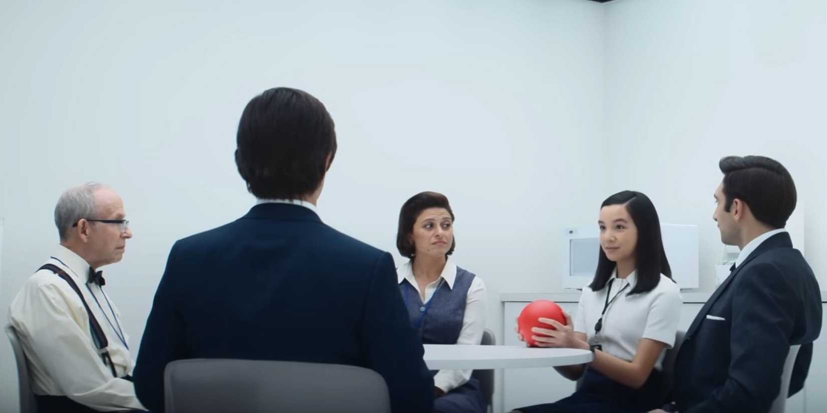 Miss Huang (Sarah Bock) leads the innies in a getting to know you game in Severance season 2