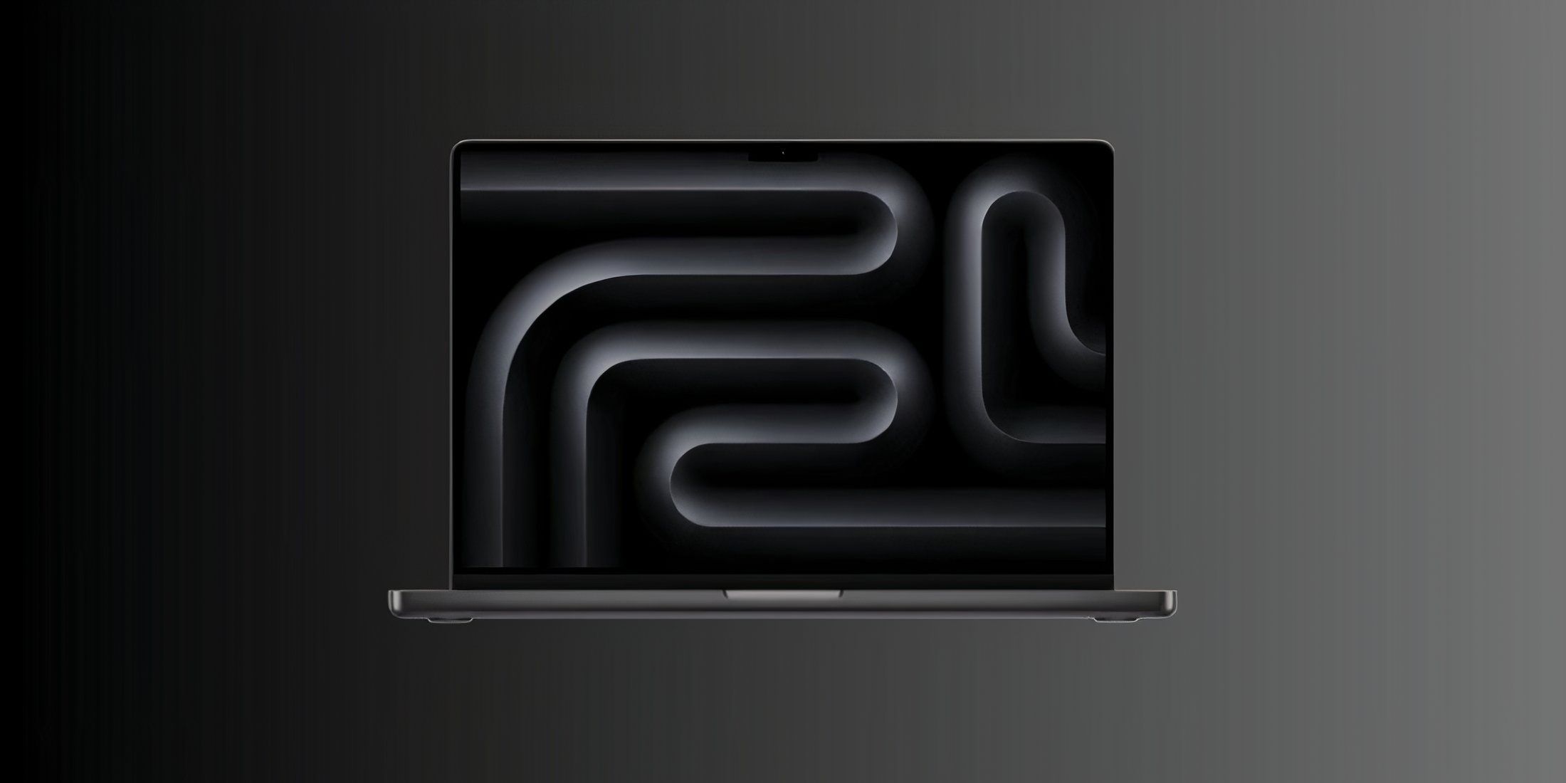 Stock image of the macbook pro m3 max on a gradient grey background.