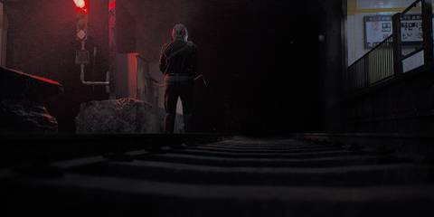 Roman looking down a subway tunnel