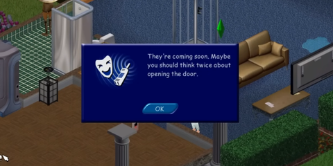 A Key Frame From The Sims Showing A Sim Receing An Ominous Phone Call-1