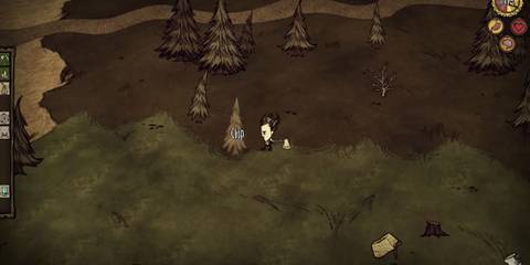 The player chops a tree in Don't Starve
