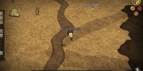 The player examines a rabbit in Don't Starve while playing the game