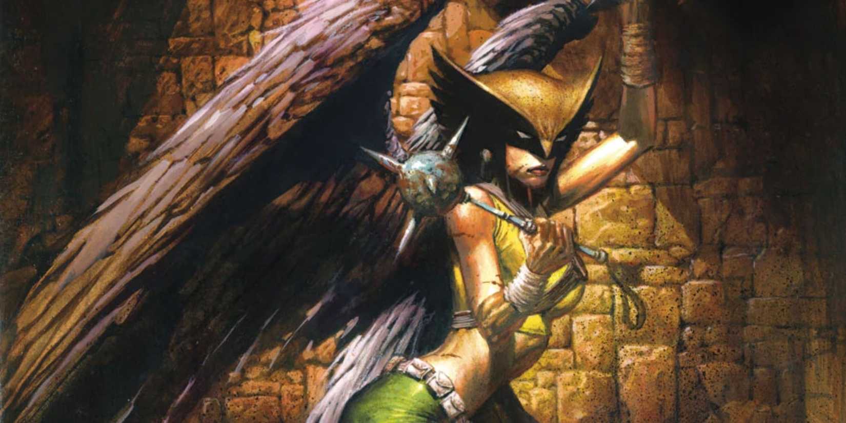 Hawkgirl standing proudly, mace in hand, wearing a battle-ready look with wings at her back.jpg