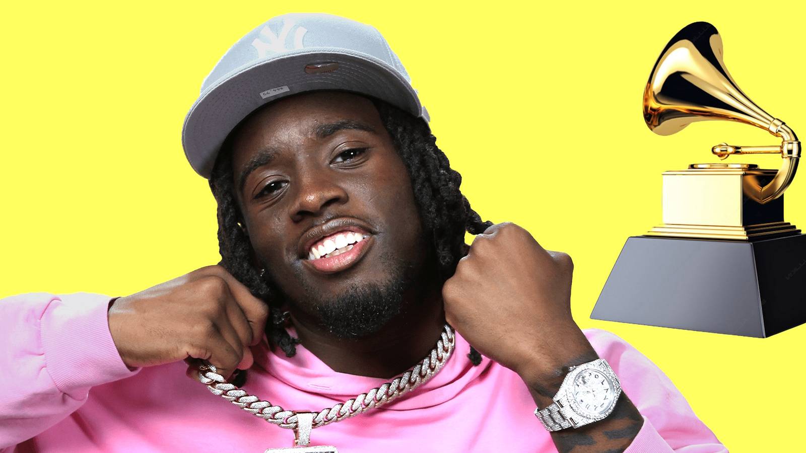 A photo of Kai Cenat with an image of a Grammy next to him.