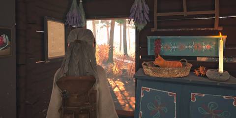 main character in REKA standing in her living room with a candle on the side.