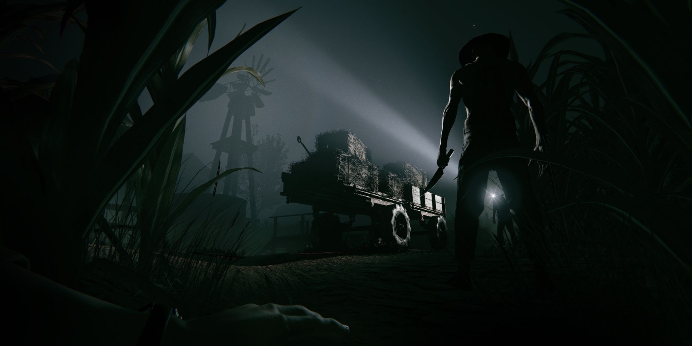 Outlast 2 Screenshot from Steam, enemy standing with a knife in the dark