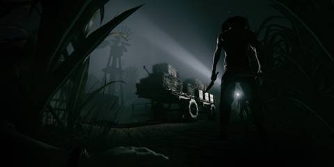 Outlast 2 Screenshot from Steam, enemy standing with a knife in the dark