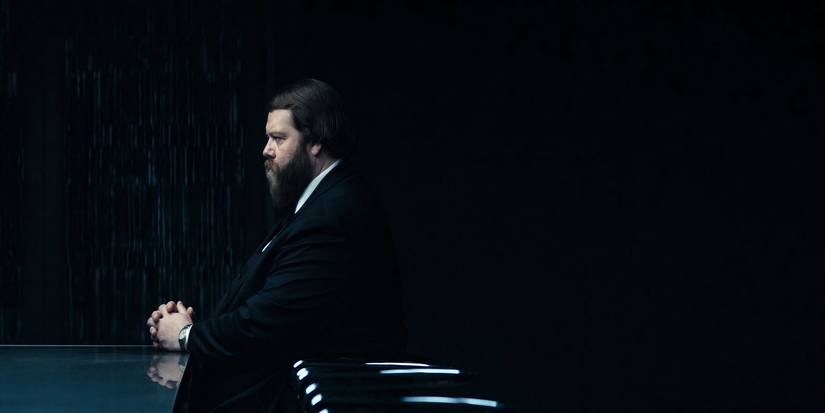 Mr. Drummond sitting in silence in Severance