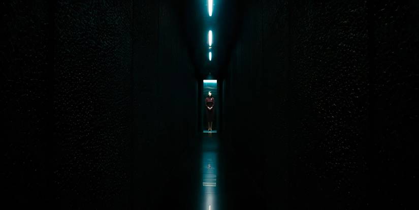 Ms. Casey going down an elevator to the test floor in Severance