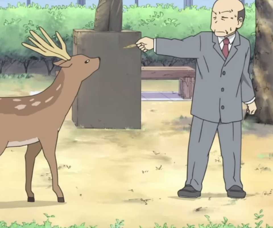 Principal Shinonome tries to give the deer a cookie.